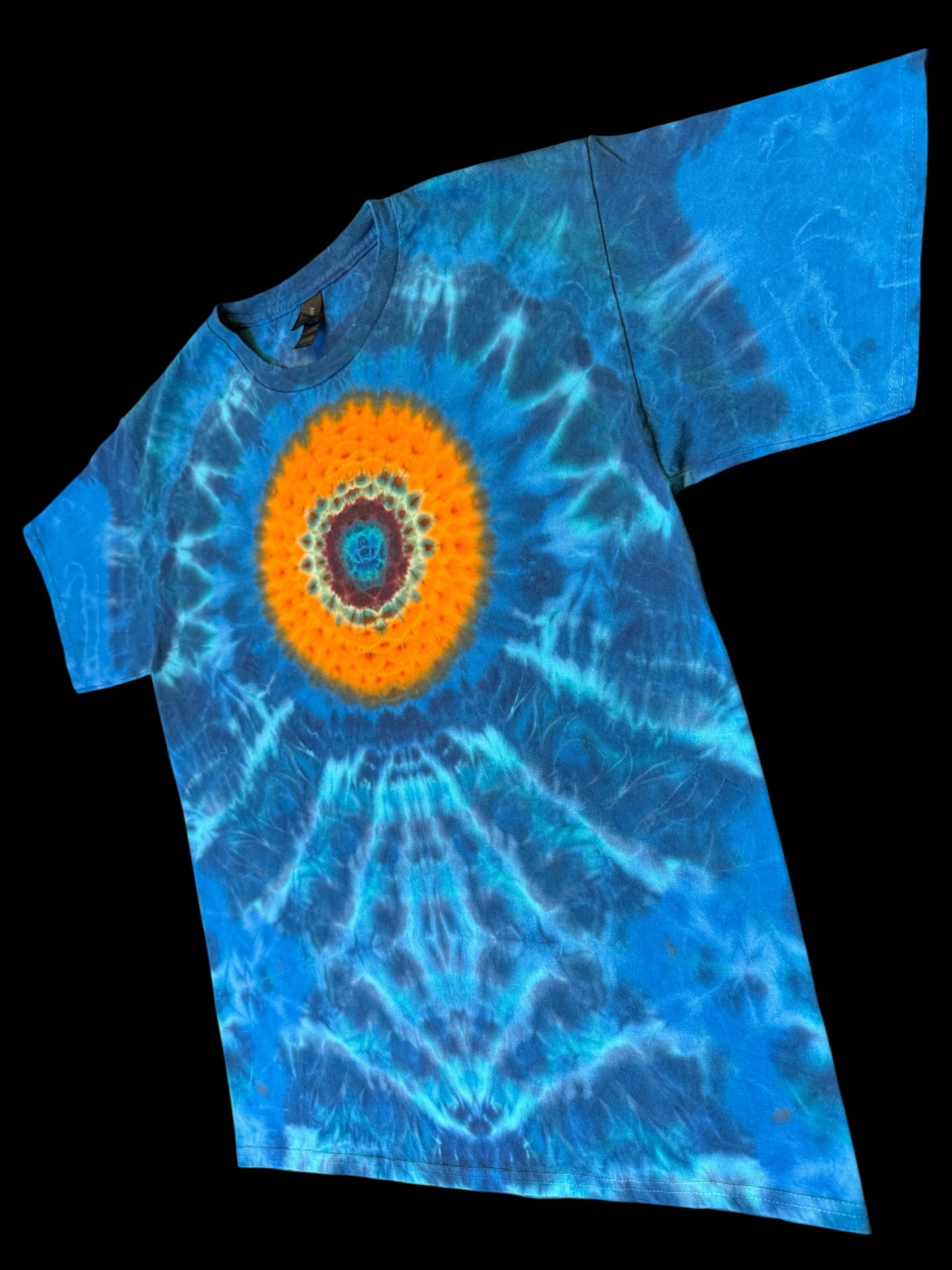 L - orange mandala on a sea of blues tee