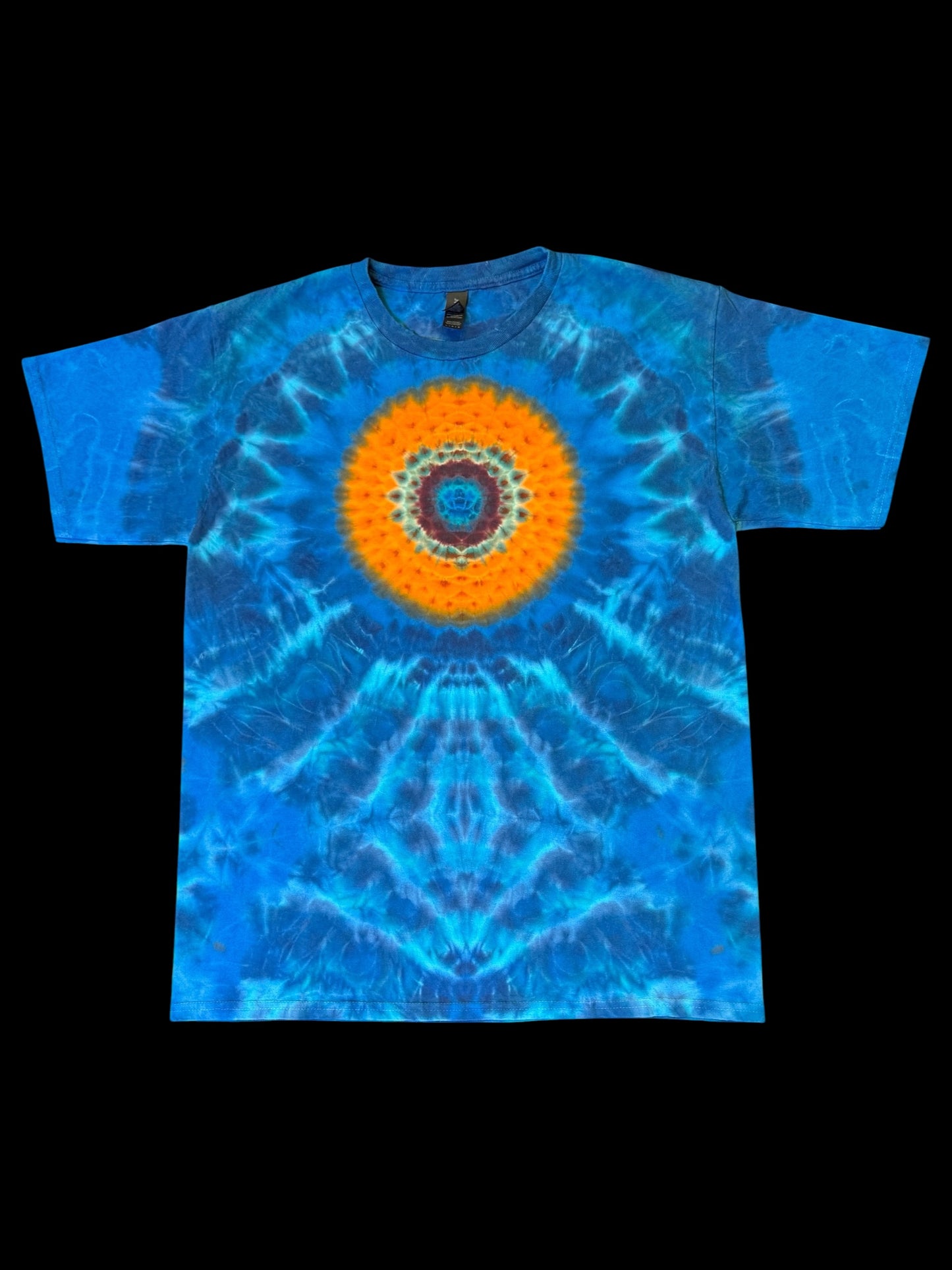 L - orange mandala on a sea of blues tee