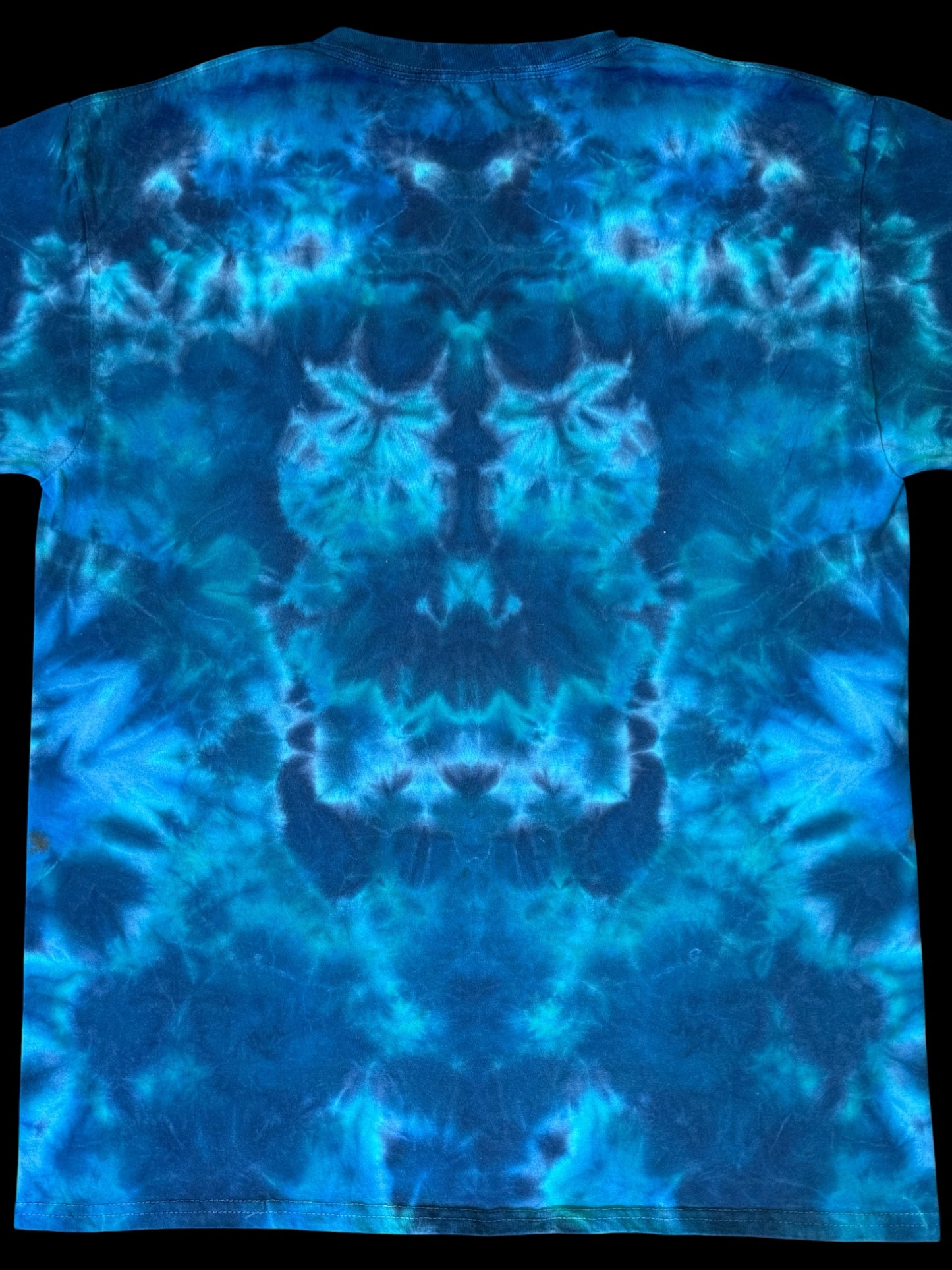L - orange mandala on a sea of blues tee