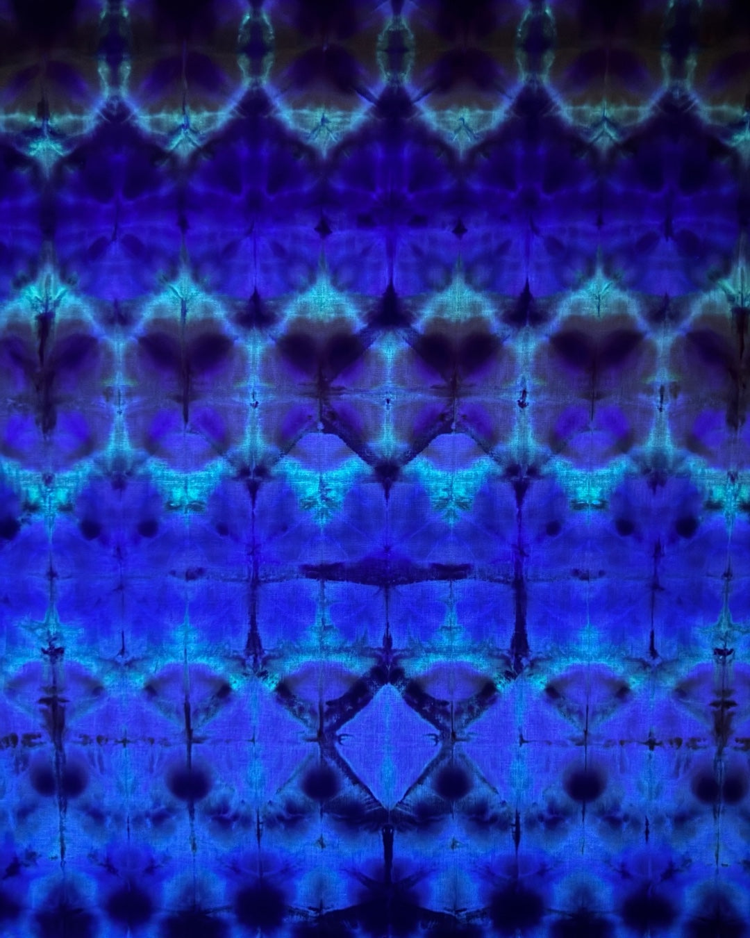 ice dyed UV reactive horizontal shibori bandana