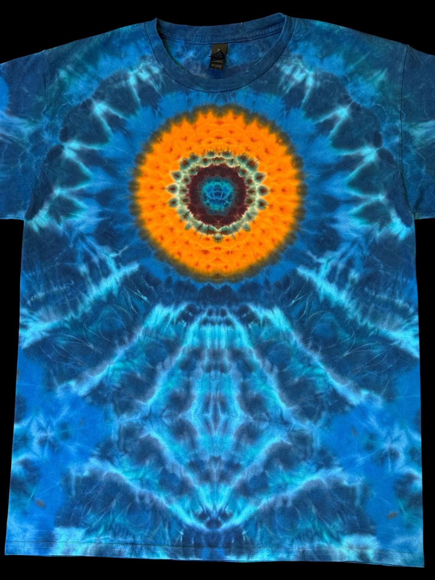 L - orange mandala on a sea of blues tee